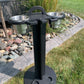 black colored 2 pc standing cup holder in a lawn