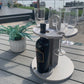 Wine Glass & Bottle Caddy placed outdoors