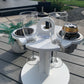 White Table Top Cup and Wine glass holder placed outdoors with soda cans