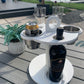 White Table Top Cup and Wine glass holder placed outdoors with Wine bottle