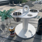 White Table Top Cup and Wine glass holder placed outdoors