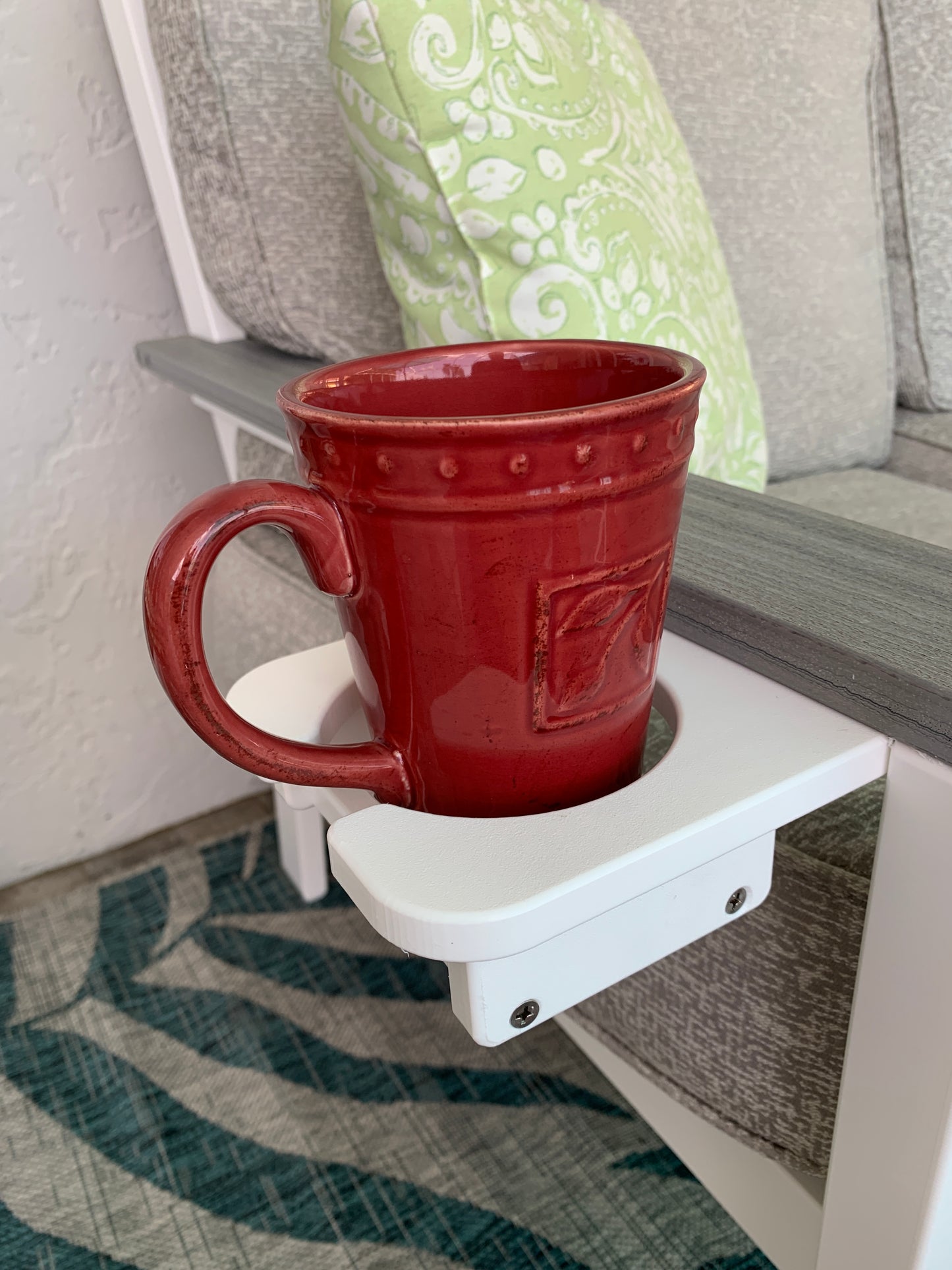 Patio Furniture Cup Holder with a red coffee mug